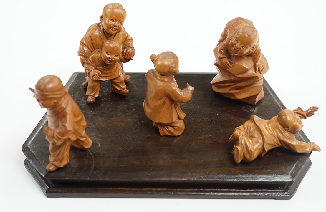 A set five Chinese carved boxwood figures of children playing Blind man’s Buff, Republic period, 23cm wide. Condition - good